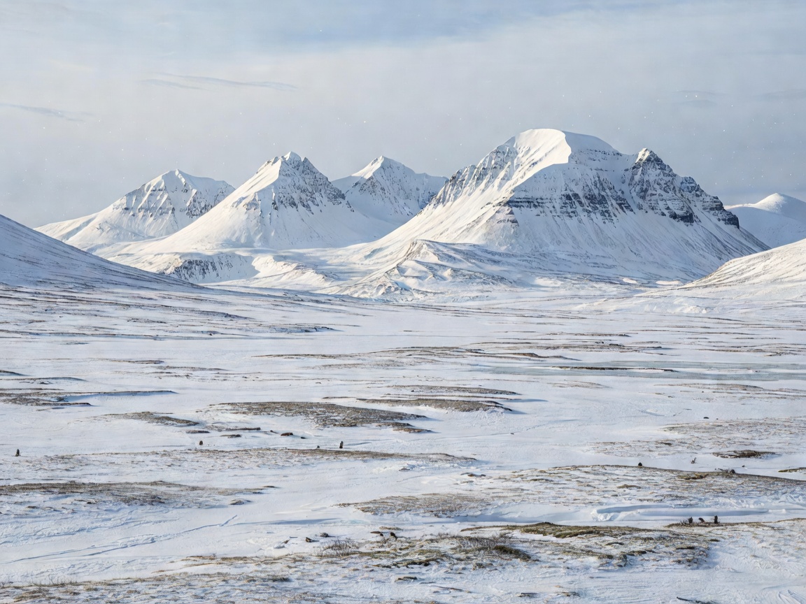 Snow covered peaks and high arctic tundra in Svalbard